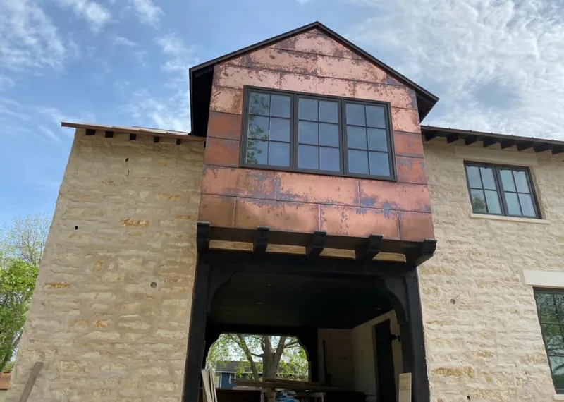 Copper metal panel facade on a stone building for Skylight Installation in Druid Hills